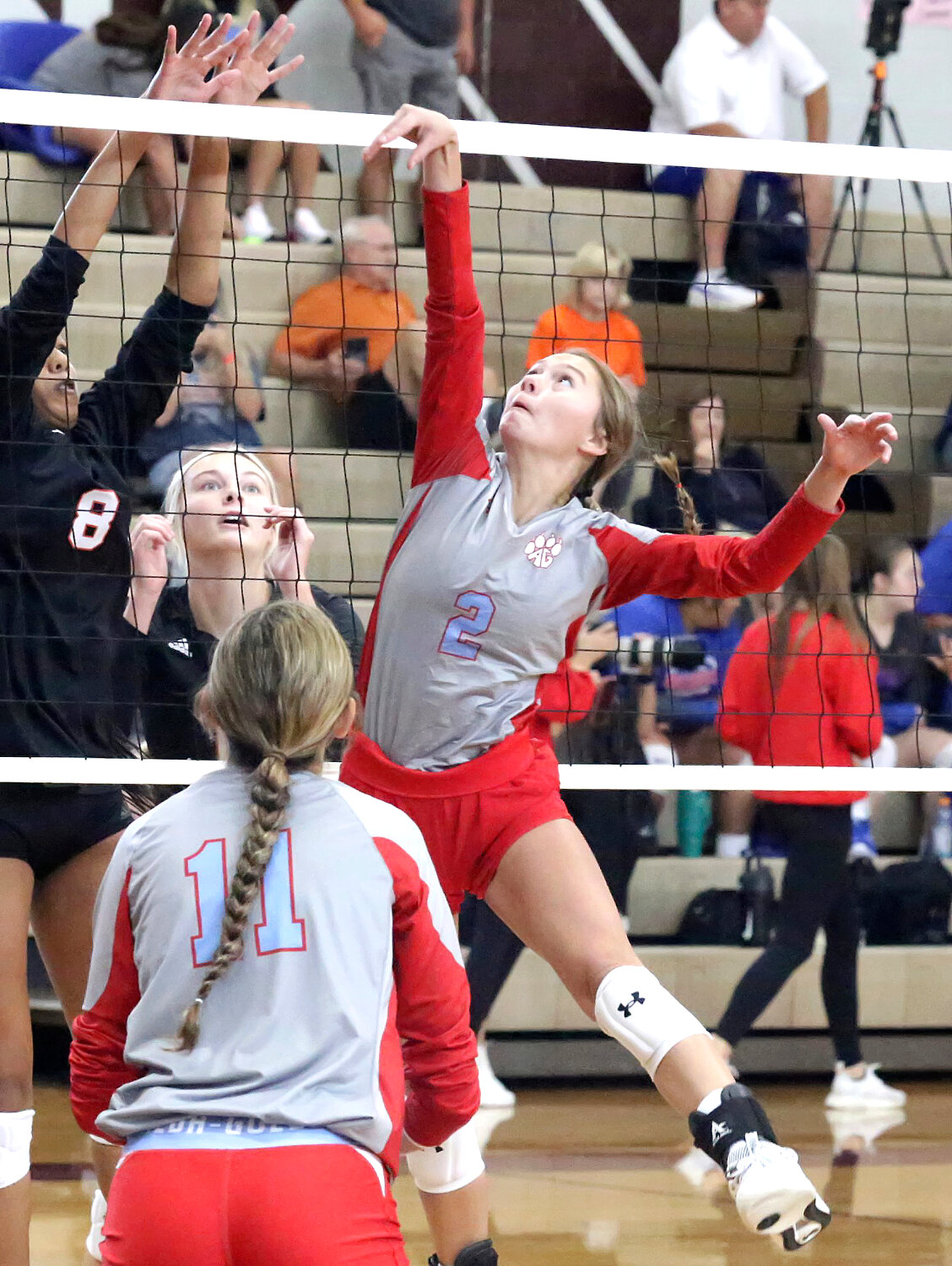 Lady Panther Kalli Trimble in action at the net.